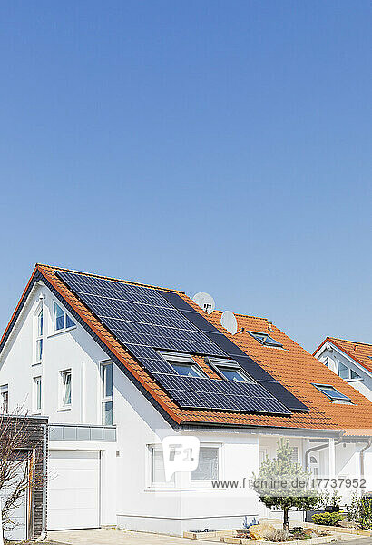 Germany  North Rhine-Westphalia  Solar panels on tiled roofs of modern suburban house