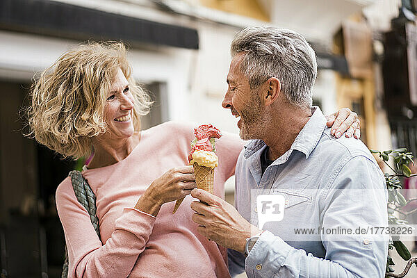 Happy mature tourists having ice cream