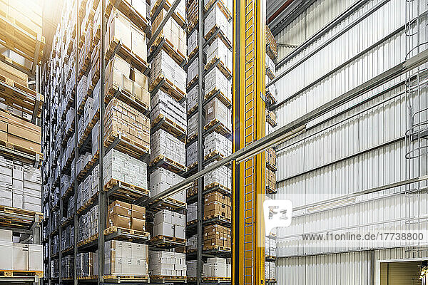 Cardboard boxes arranged on rack in warehouse