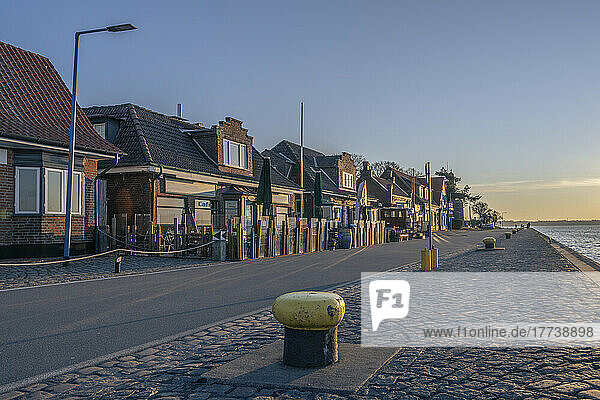 Germany Schleswig-Holstein Kiel Row of beachside houses at dawn