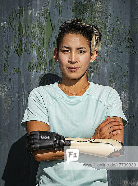 Portrait of athletic woman with prosthetic arm