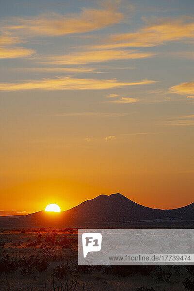 USA  New Mexico  Santa Fe  Sun setting over hills in Cerrillos Hills State Park