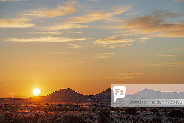 USA  New Mexico  Santa Fe  Sun setting over hills in Cerrillos Hills State Park