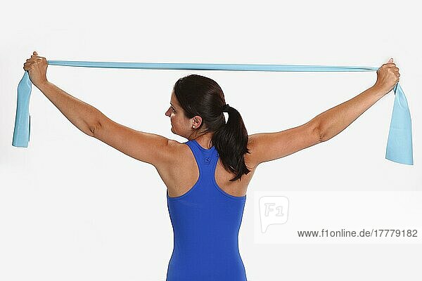 Woman doing sports exercise with Thera-Band  sports exercises