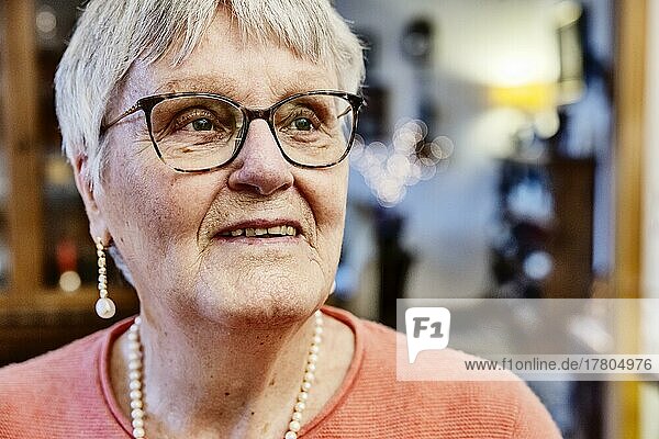 Portrait of a senior citizen with glasses at home  Bocholt  North Rhine-Westphalia  Germany  Europe