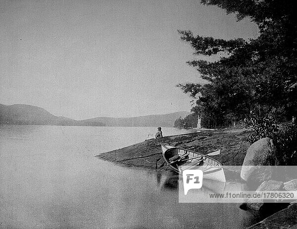 Man relaxing on the shore looking a  Historic  digitally restored reproduction of a 19th century photographic original on Lake George  with a rowboat in front  New York  ca 1880  America