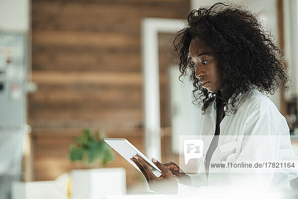 Female doctor using tablet PC