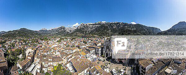 Spain  Balearic Islands  Soller  Helicopter panorama of Church of Saint Bartholomew and surrounding houses with Serra de Tramuntana mountains in background