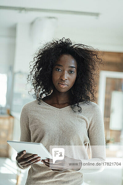 Young woman holding tablet PC