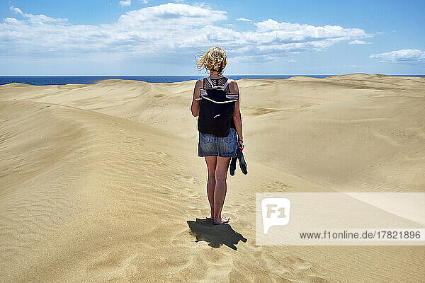 Spain  Gran Canaria  Female tourist visiting Maspalomas Dunes