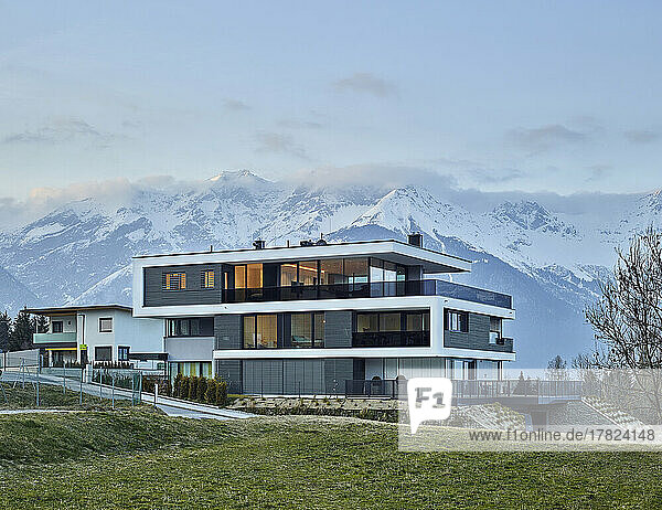 Austria  Tyrol  Facade of luxurious three-storey house in mountains