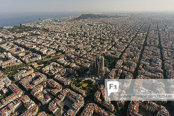 Spain  Catalonia  Barcelona  Helicopter view of Sagrada Familia basilica and surrounding cityscape