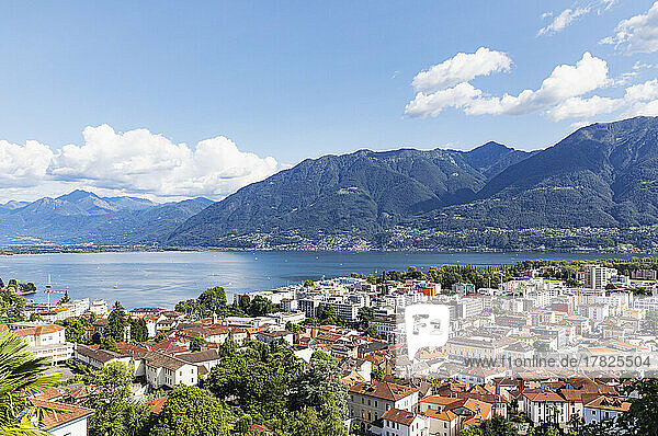 Switzerland  Ticino  Locarno  City houses with Lake Maggiore and surrounding mountains in background