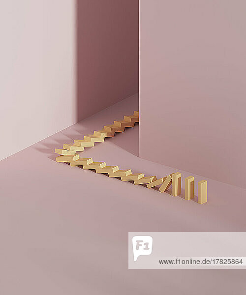 Studio shot of falling domino pieces placed around corner