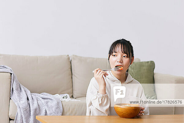 Young Japanese woman enjoying a meal