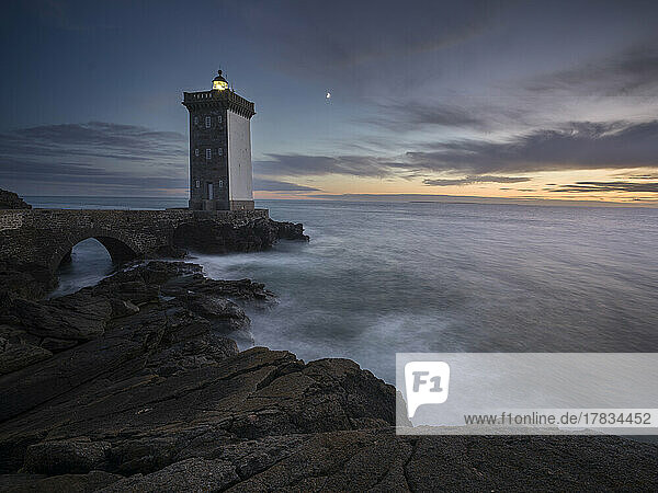 Blue hour long exposure over the the sea at Kermorvan lighthouse  Finistere  Brittany  France  Europe