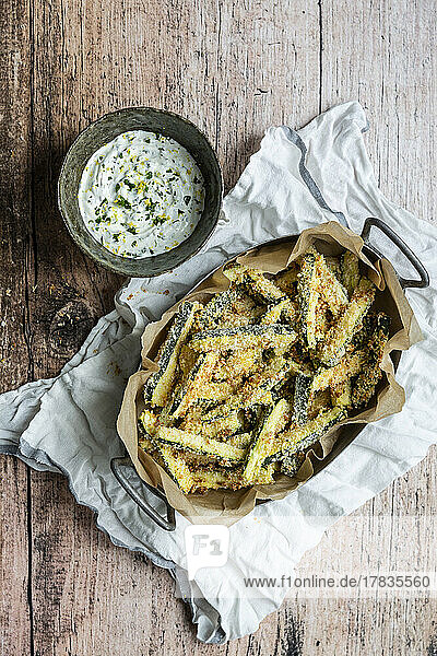 Baked courgette fries with panko breadcrumbs and parmesan cheese coating