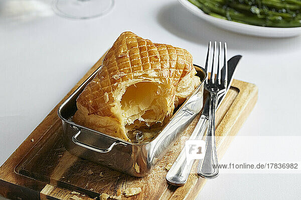 Mushroom puff pastry pie with green beans on the side