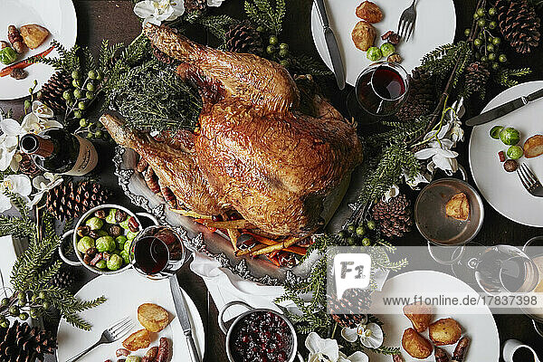 Christmas table setting featuring a large turkey