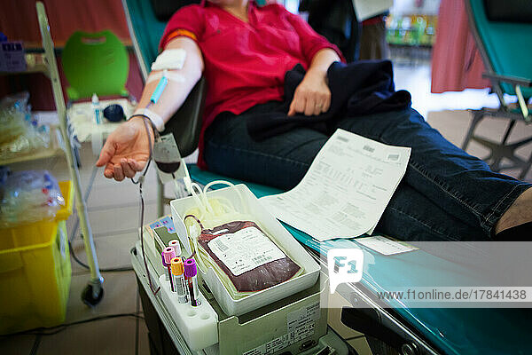 Blood donor in a blood collection facility.
