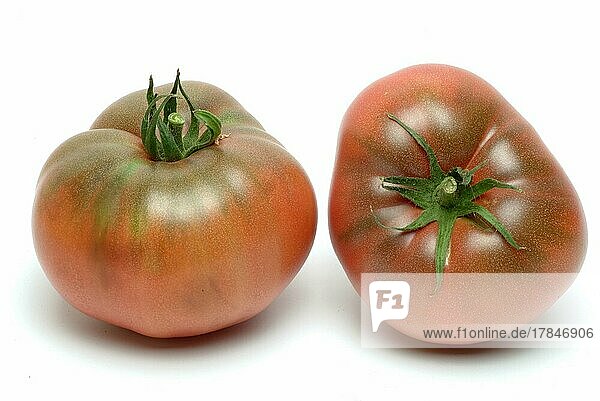 Ripe tomatoes of the Cherokee Tiger variety  red with green stripes