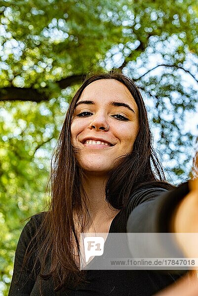 A beautiful girl making a selfie smiling in camera
