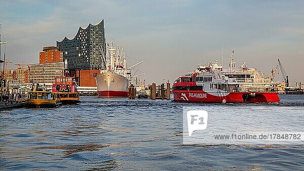 Catamaran from Helgoland on the Elbe in front of the Elbe Philharmonic Hall in Hamburg harbour  Hamburg  Land Hamburg  Northern Germany  Germany  Europe