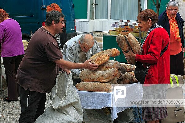 Selling bread at the market in Souillac in the Lot department in the far north-west of the Occitanie region in southern France