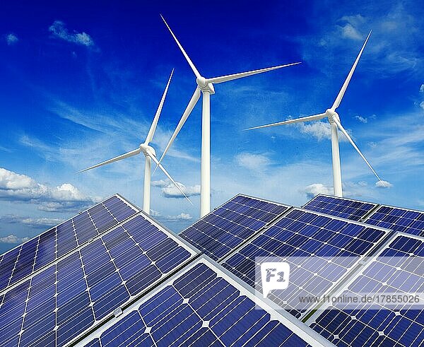 Grünes alternatives Energie- und Umweltschutz-Ökologiekonzept  Solarbatterie-Paneele und Windgenerator-Turbinen vor blauem Himmel