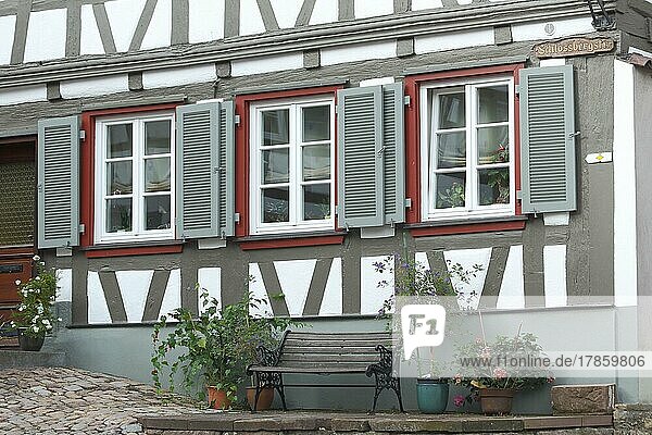 Half-timbered house with three shutters and bench in Schlossbergstraße  Schiltach  Southern Black Forest  Black Forest  Baden-Württemberg  Germany  Europe