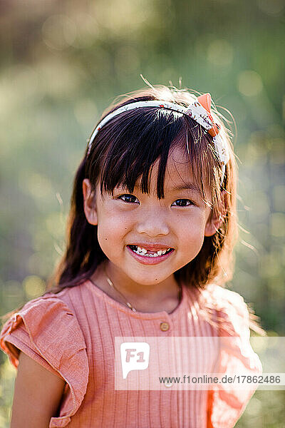 Head Shot of Six Year Old Asian Girl at Park in San Diego