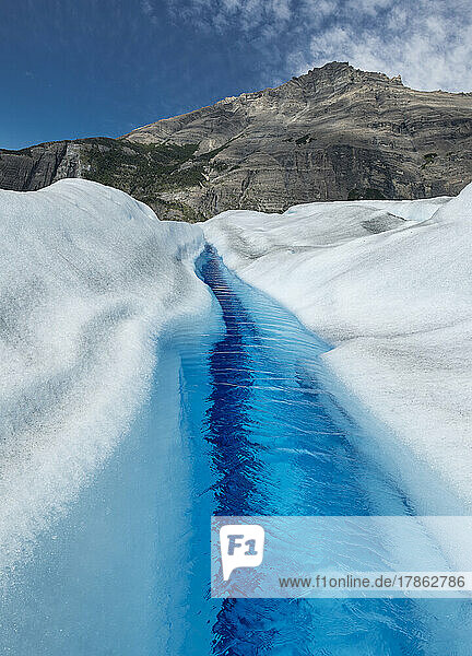 A small river runs down the Perito Moreno glacier.