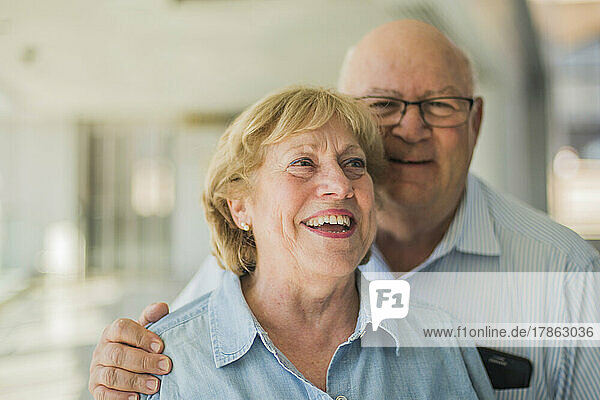 Happy senior couple traveling at airport