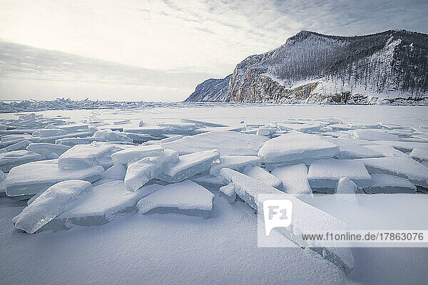 snowed ice blocks over frozen lake