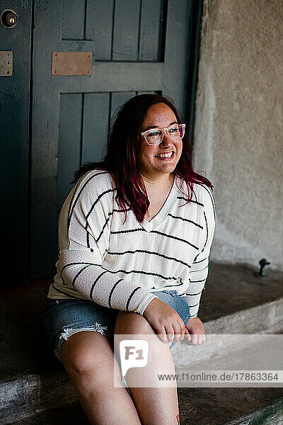 Size Inclusive Model Wearing Light Sweater & Denim Shorts in San Diego