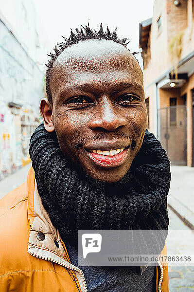 close up black man of african ethnicity smiling