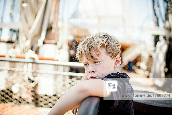 Eight Year Old Boy Exploring Sailboat at Maritime Museum in San Diego