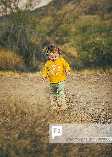 A kid is walking in Lost Dutchman State Park