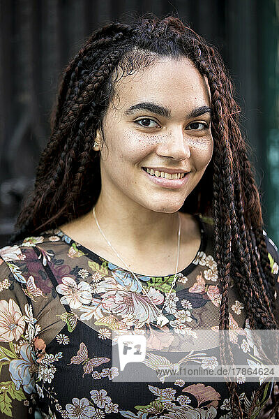 Portrait of Young Cuban Woman with freckles smiling