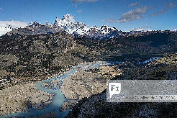 The green water of glacial melt winds its way down a valley in P