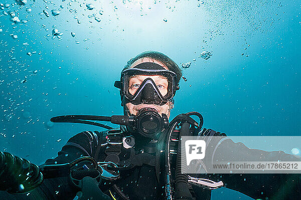 diver taking a selfie on a dive around Phuket