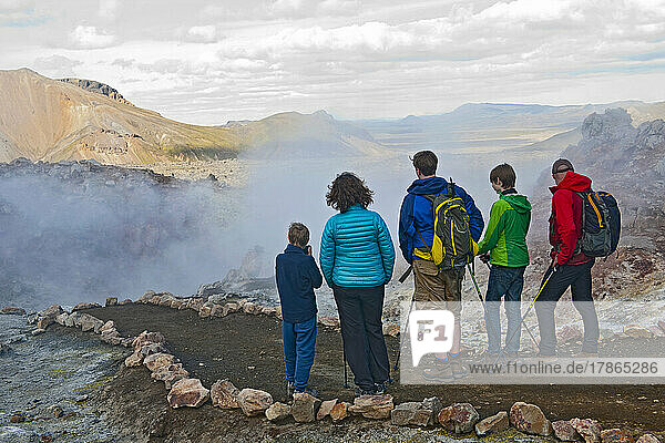 family hiking in Landmannalaugar - a geothermal area in Iceland