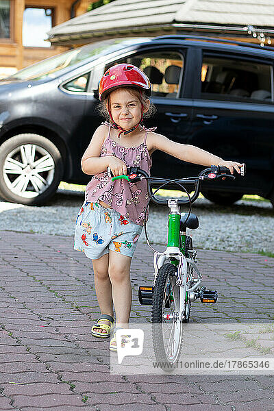 little child riding a bicycle