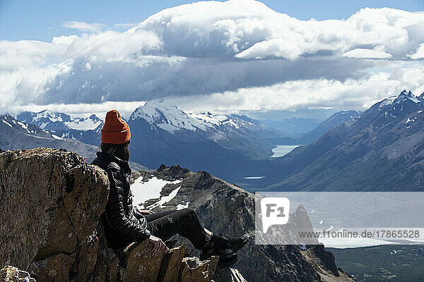 A hiker takes in the view after summiting Mt. Madsen.