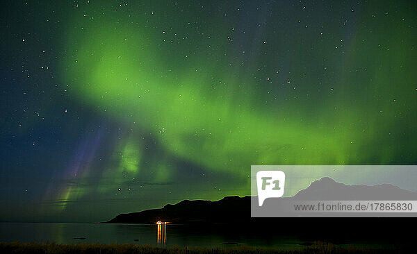 Northern lights over a fjord in the remote east of Iceland