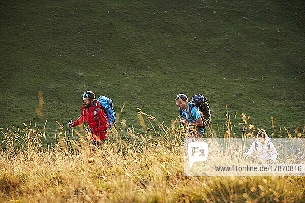 Hikers with backpacks on mountain  Mutters  Tyrol  Austria
