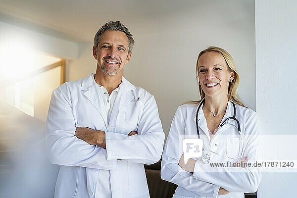 Portrait of confident male and female doctor