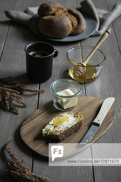 Studio shot of slice of pumpkin bread with honey