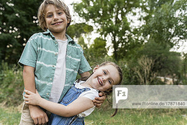 Happy siblings enjoying at park