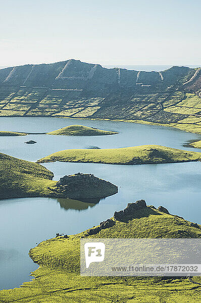 View of mountains and lake on sunny day at Corvo Island  Azores  Portugal